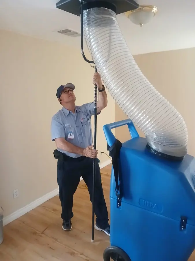 HVAC Installation technician using HEPA equipment in Upper Grand Lagoon